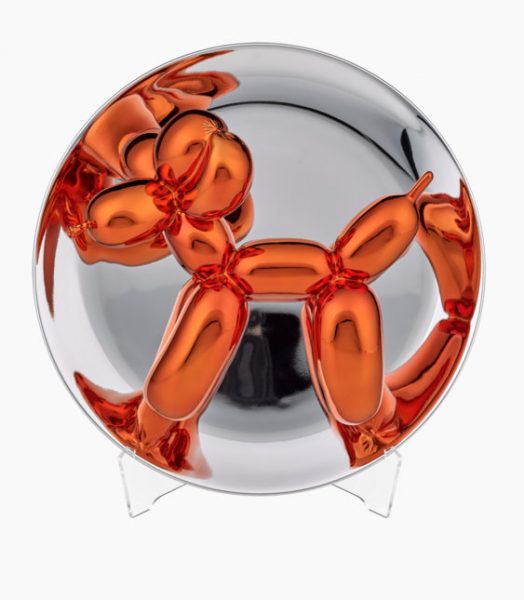 Orangener Ballonhund, gezwängt in eine Glaskugel.